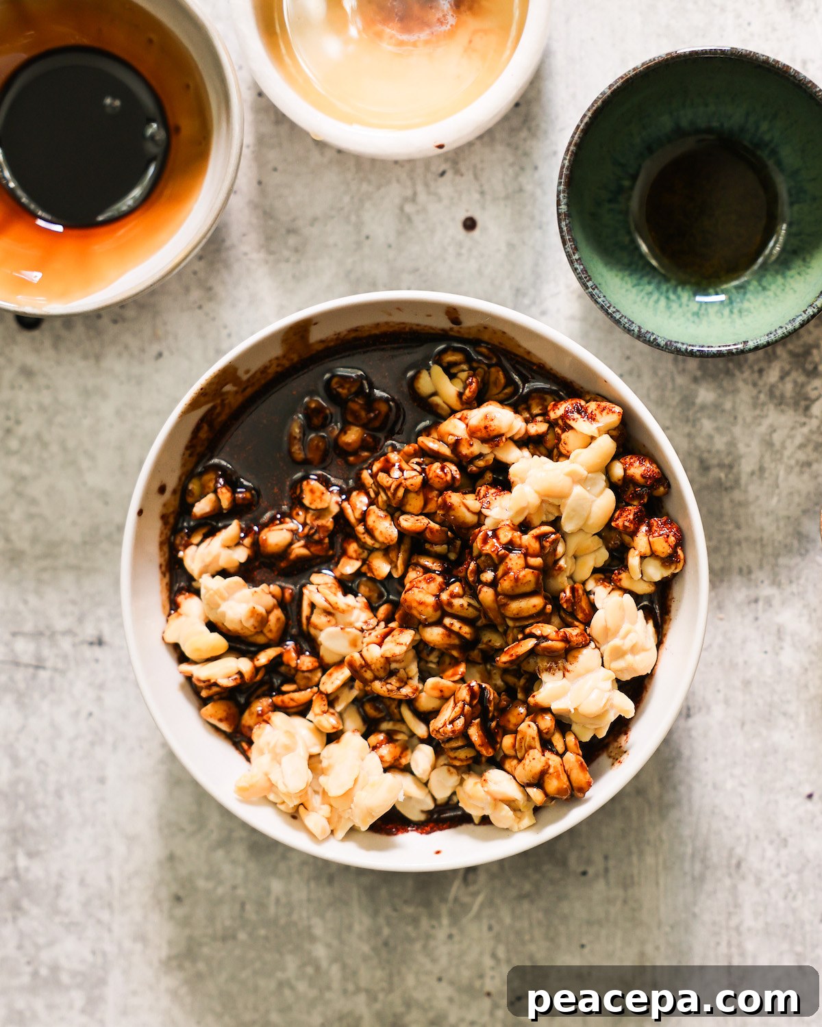 marinade poured over tempeh in a white bowl