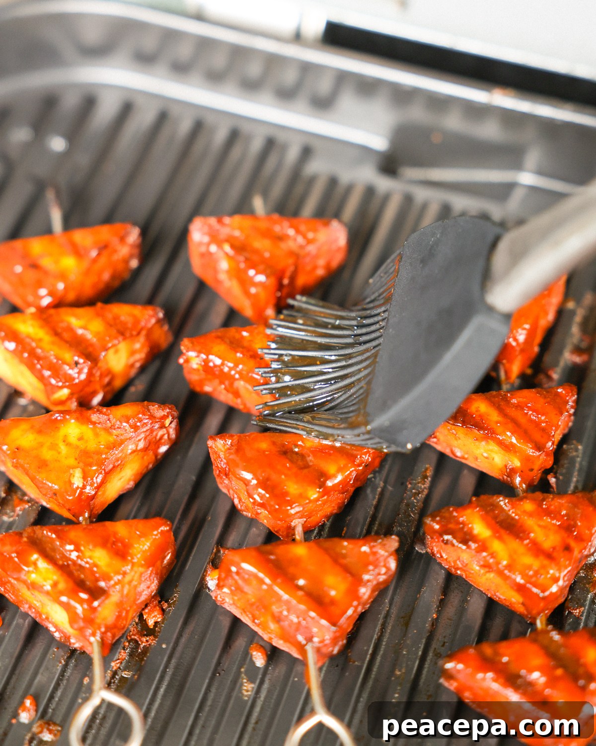 basting tofu on grill