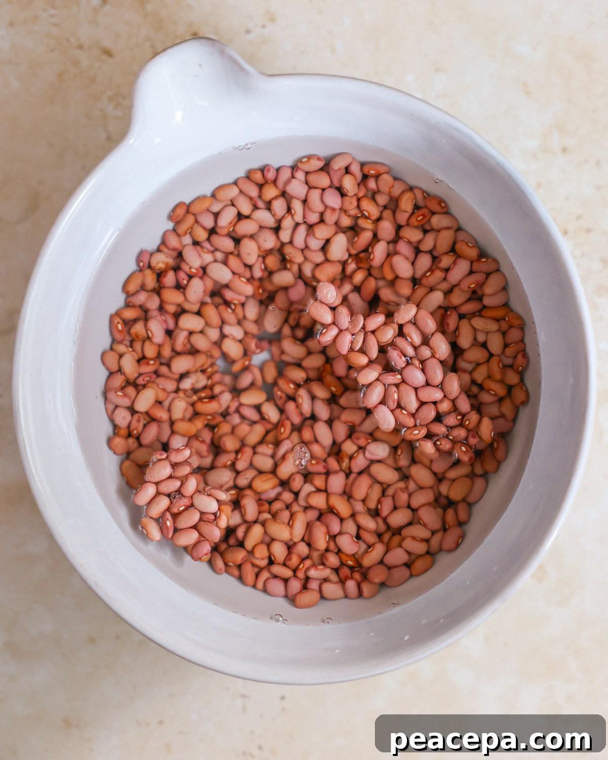 Soaking beans in a large bowl. 