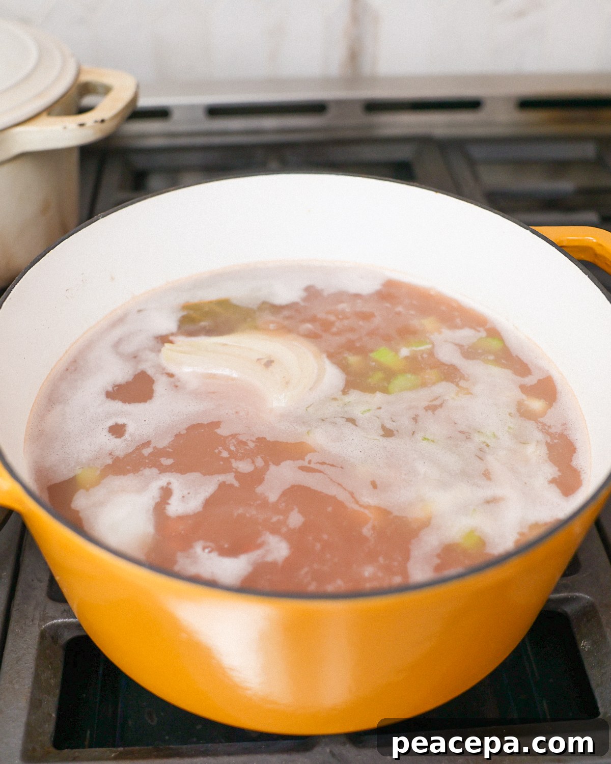 Beans boiling in a large pot.