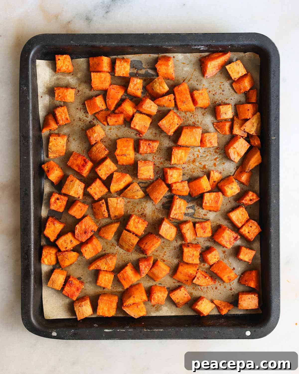Roasted sweet potatoes on baking sheet.
