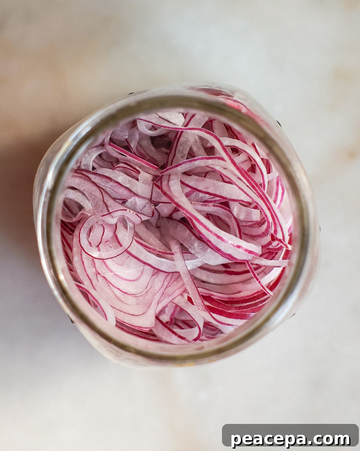 onion slices in a glass jar