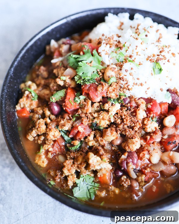 Bowl of Vegan Tofu Chili with rice.