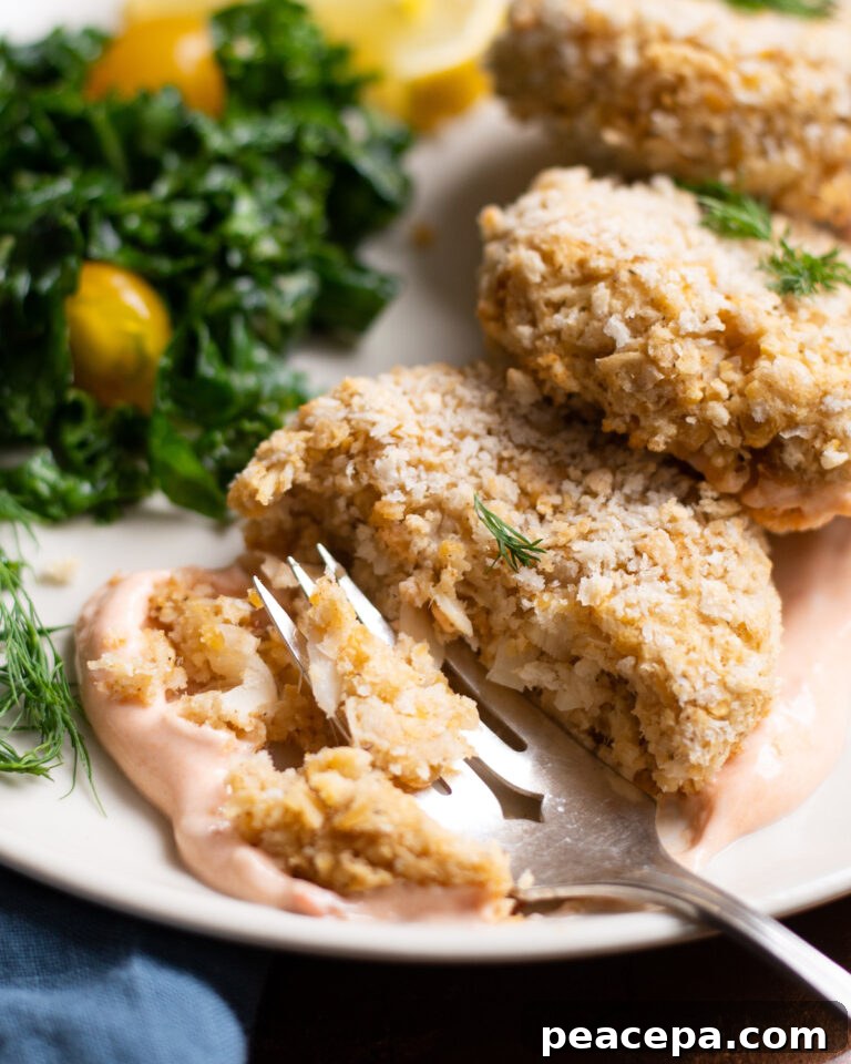 Fork cutting into Vegan Crab Cake on a plate.
