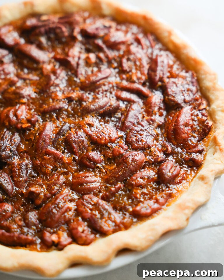 Whole Vegan Pecan Pie in a pie plate.