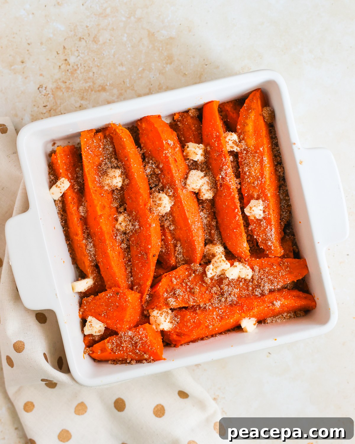 layered sweet potatoes in baking dish