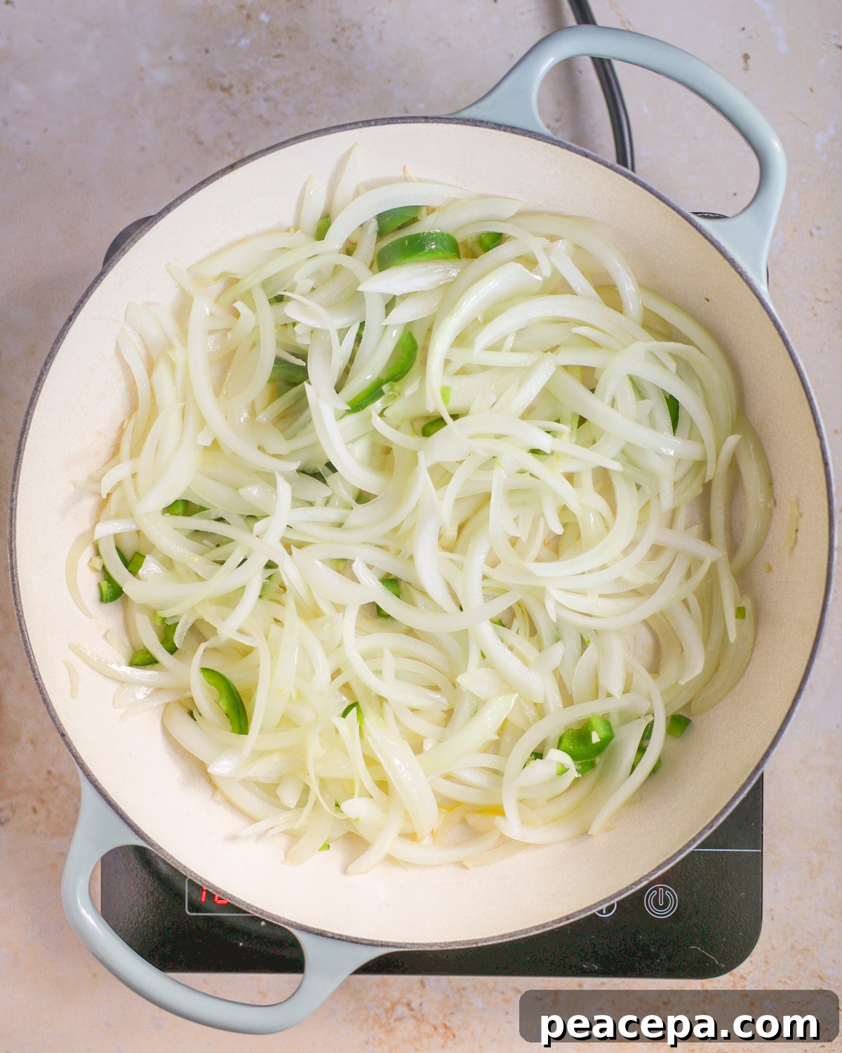 Sautéeing aromatics in skillet.