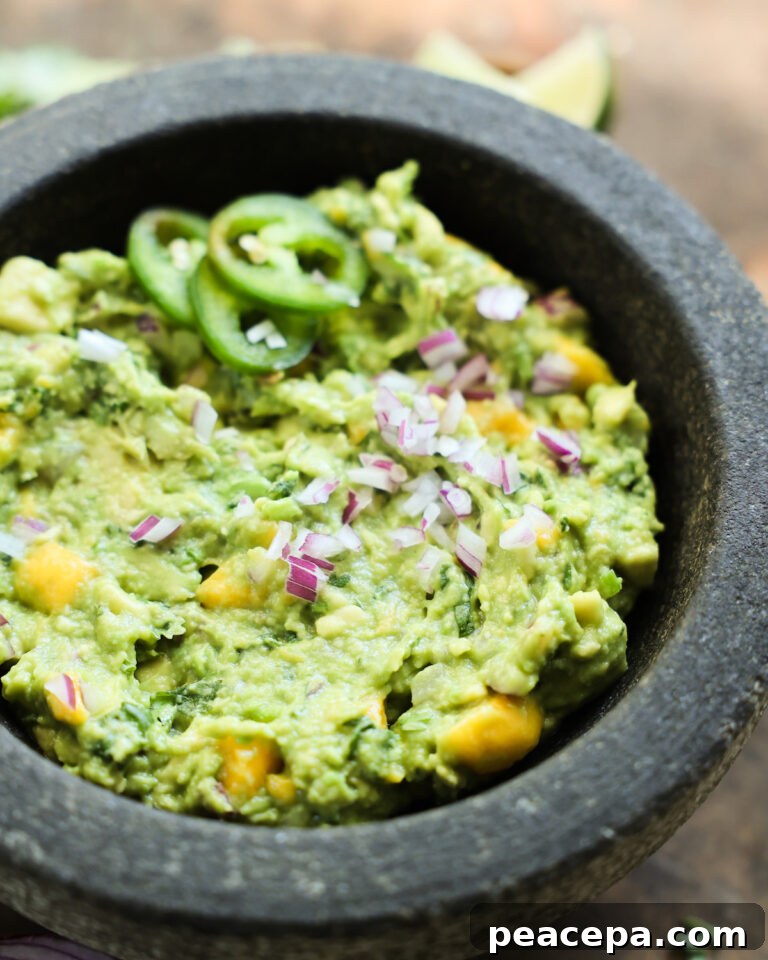 Mango Guacamole in a stone mortar.