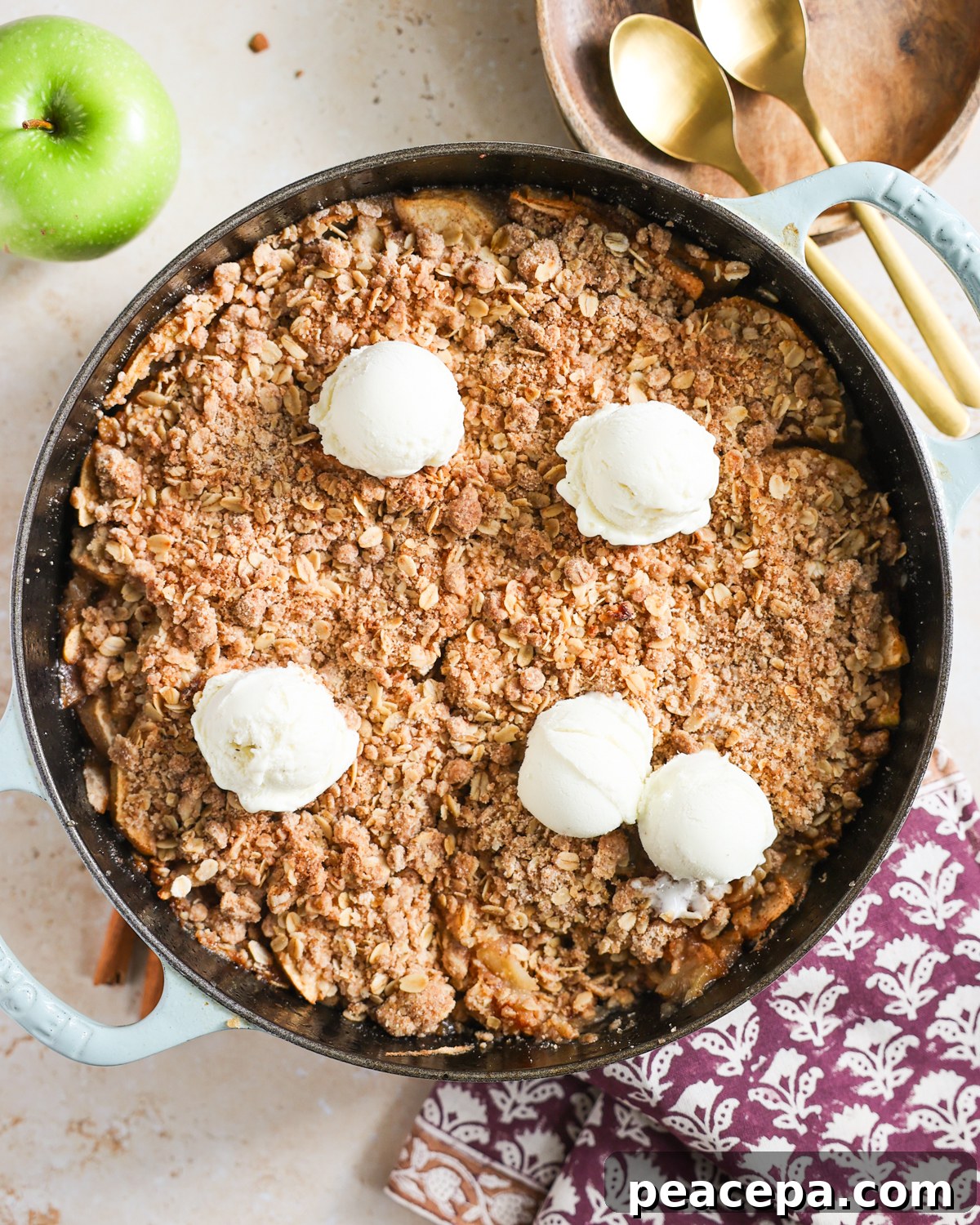 Apple crisp topped with vegan ice cream.