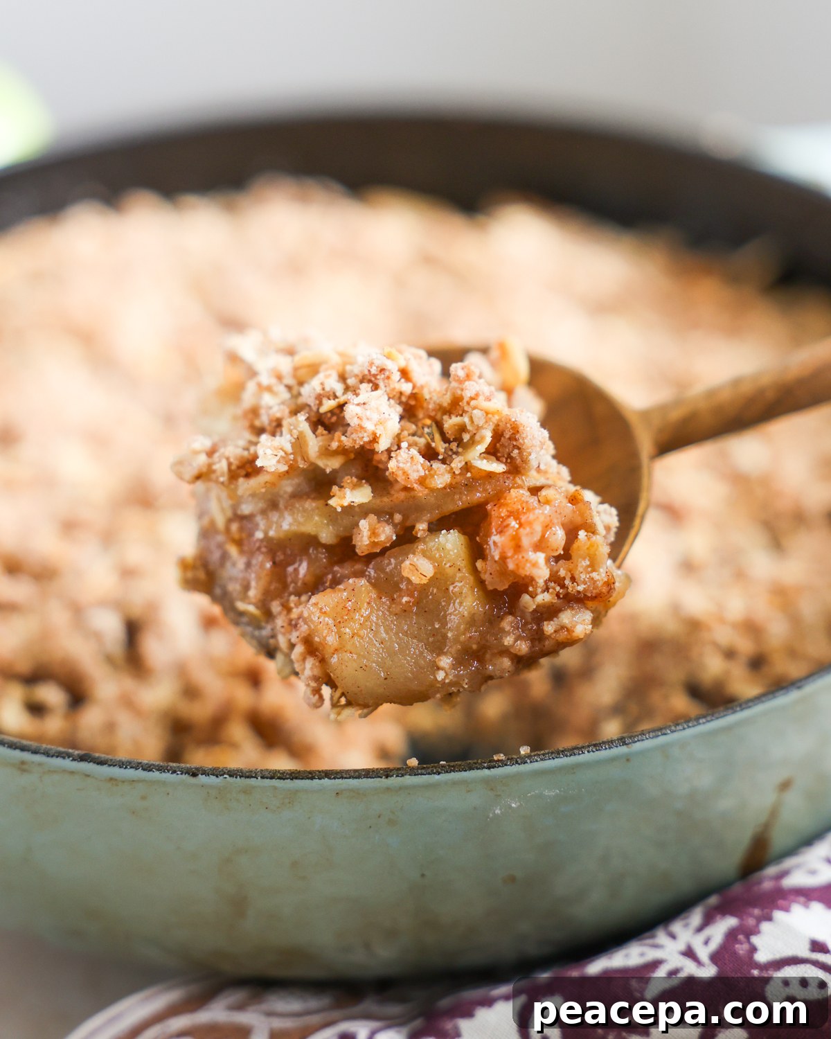 Apple crisp emerging from the skillet.