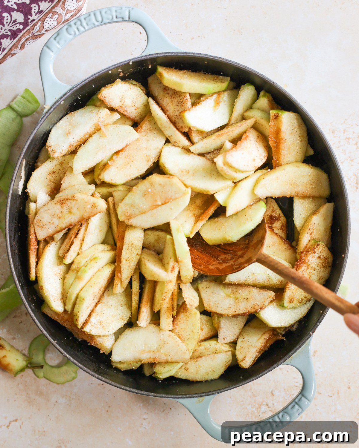 Stirring apples in their spices. 