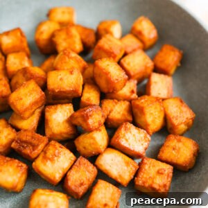 Air fried tofu on a plate.