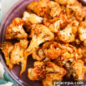 close up of air fryer cauliflower on a purple plate