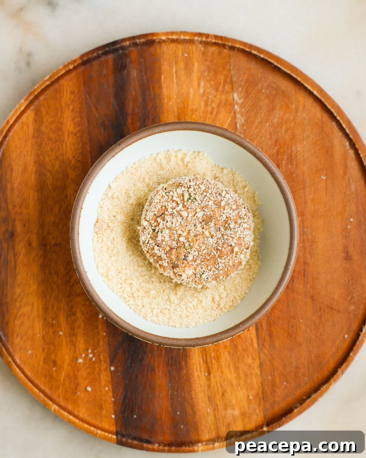 Coating fritters in panko mixture.
