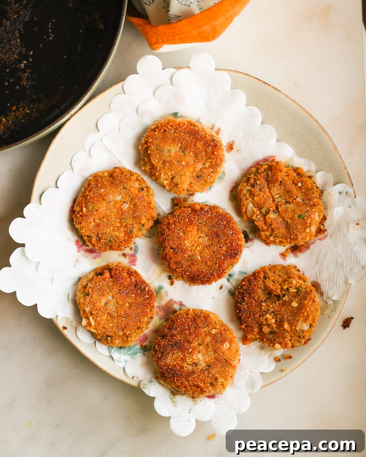black eyed pea fritters draining on paper towel.