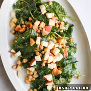 overhead of baby kale salad on white platter
