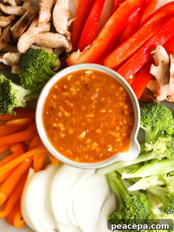 Stir Fry Sauce in bowl surrounded by veggies