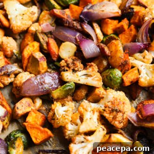 Roasted vegetables on a baking pan.