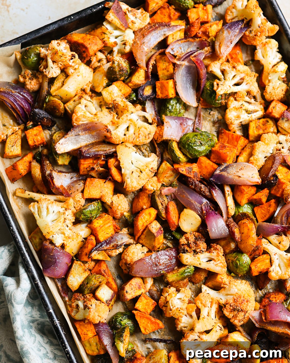 Roasted vegetables on a baking sheet.