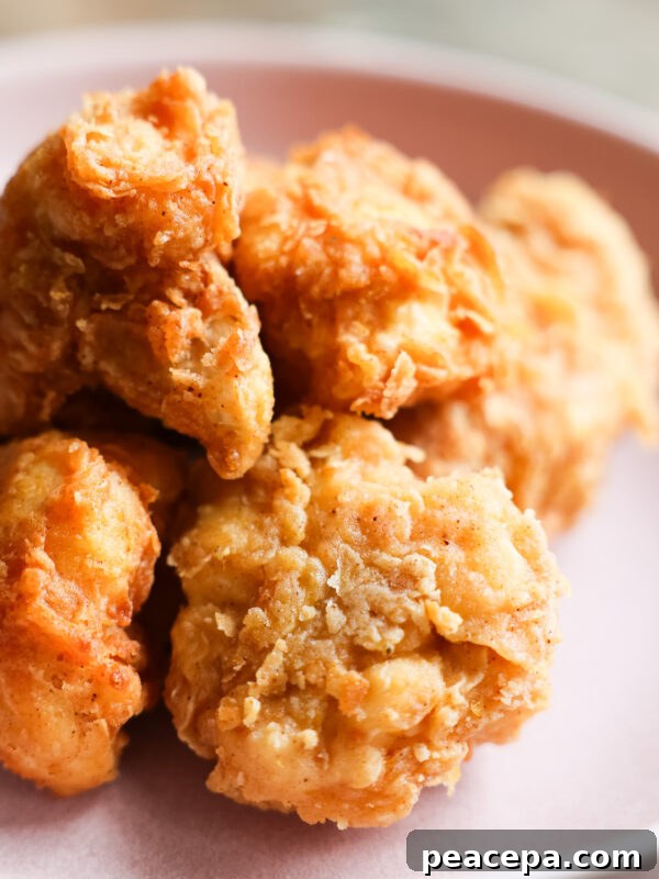 Closeup of vegan fried chicken on pastel purple plate