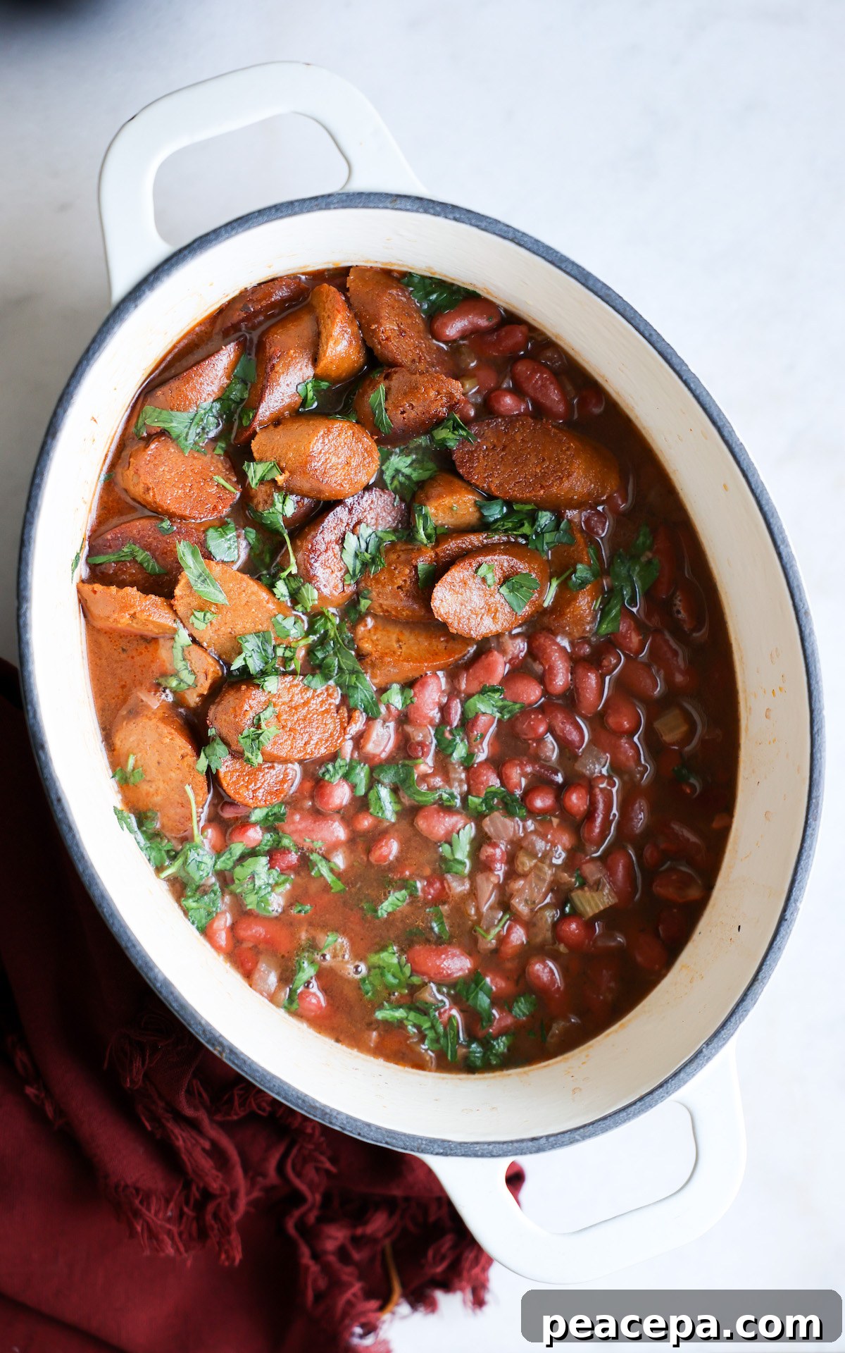 cooked red beans in a white dutch oven pot