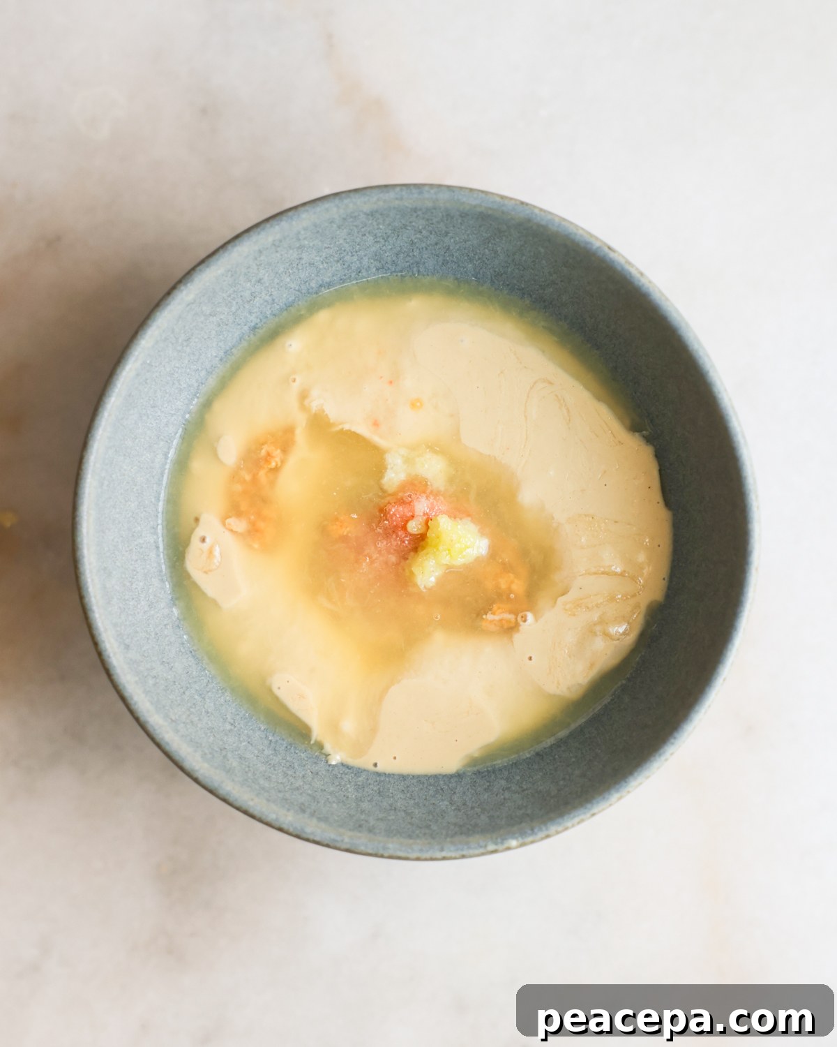 miso tahini dressing ingredients in a bowl