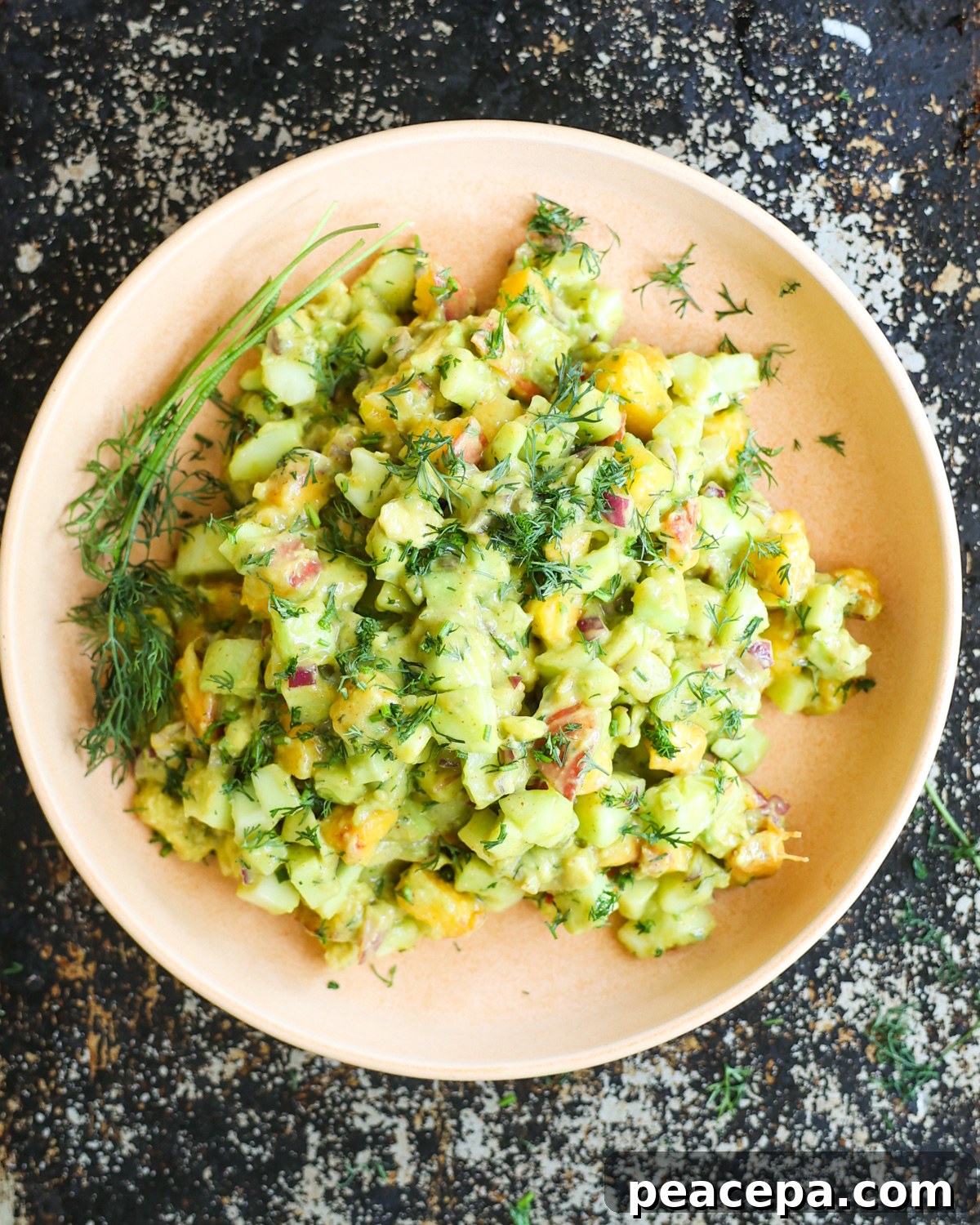 overhead of cucumber avocado salad