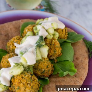 Sweet Potato Falafel Sandwich with cucumber avocado salad and lemon tahini sauce