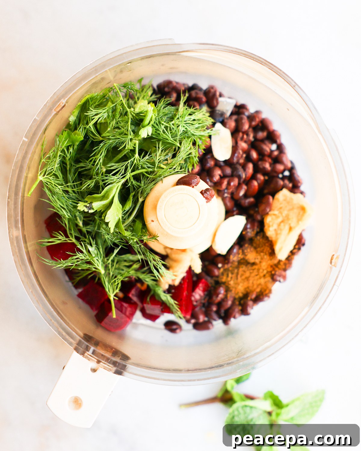 Ingredients for beet dip in a food processor.