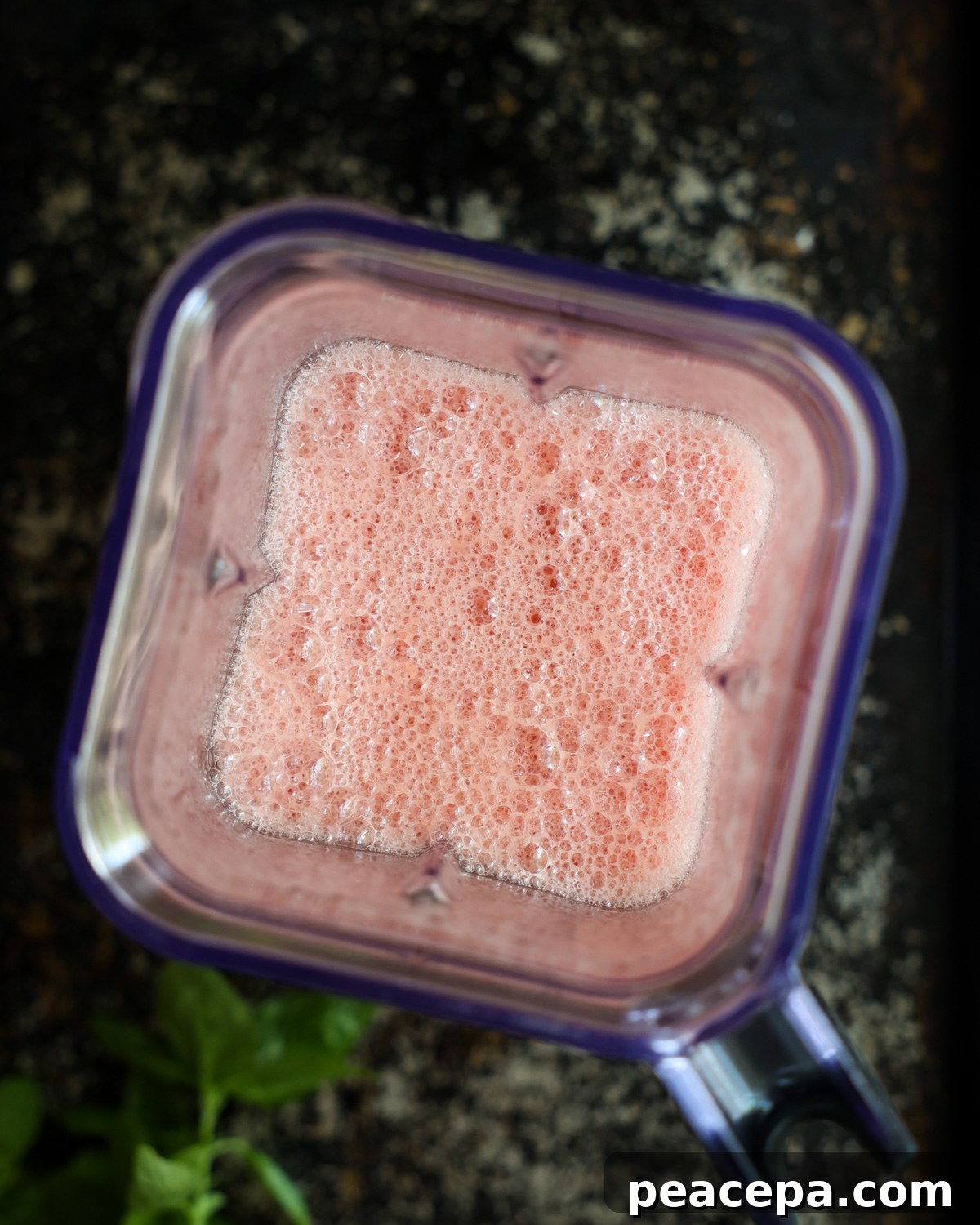 overhead of watermelon smoothie in a blender