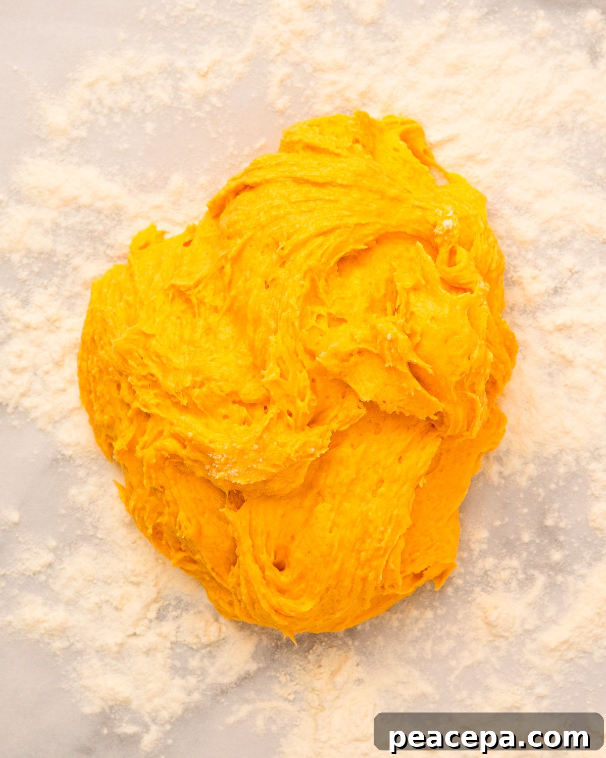 sticky biscuit dough on floured counter