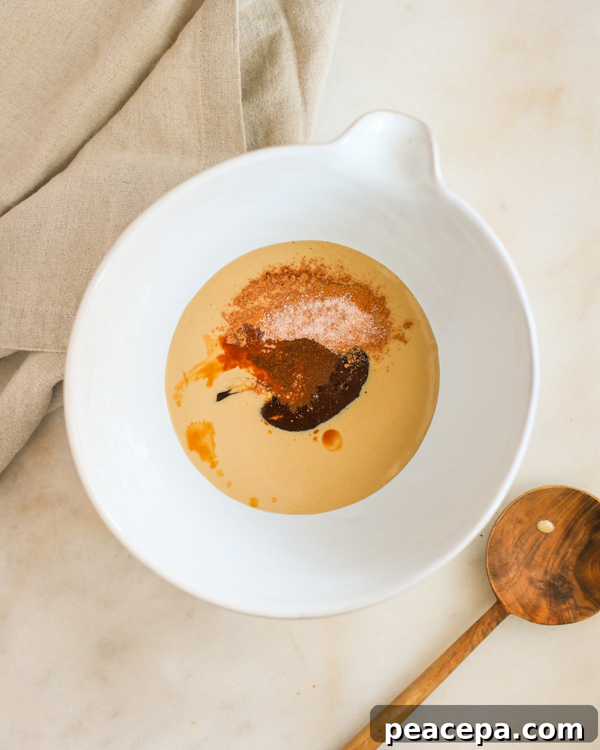 tahini and wet ingredients in mixing bowl