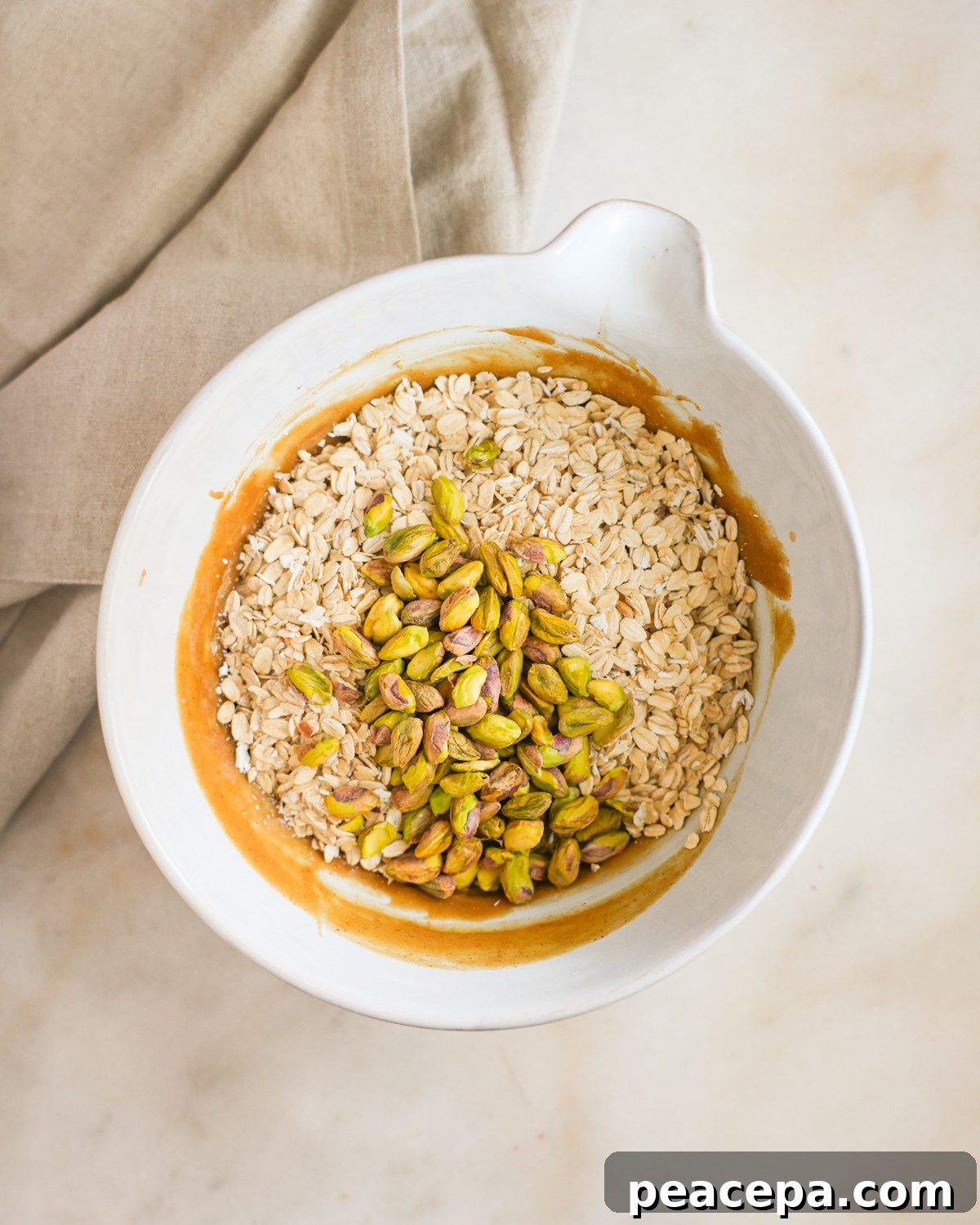 oats and nuts added to mixing bowl