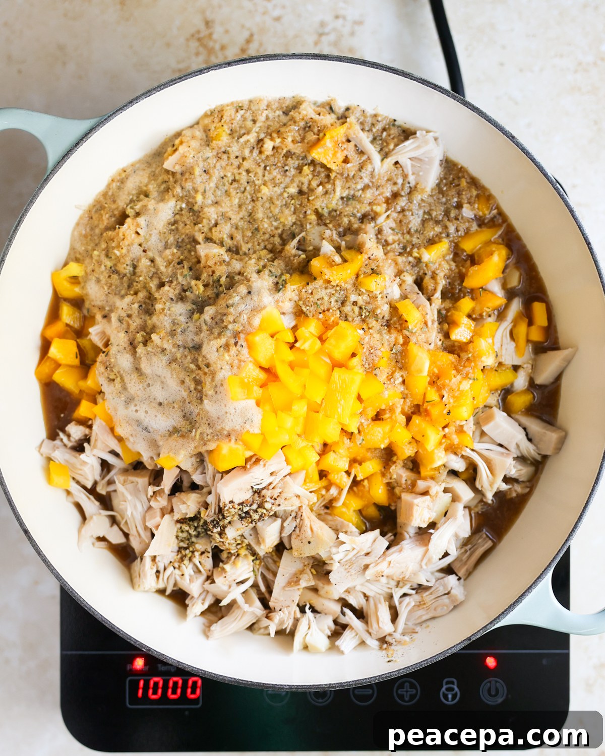 overhead jerk sauce added to skillet