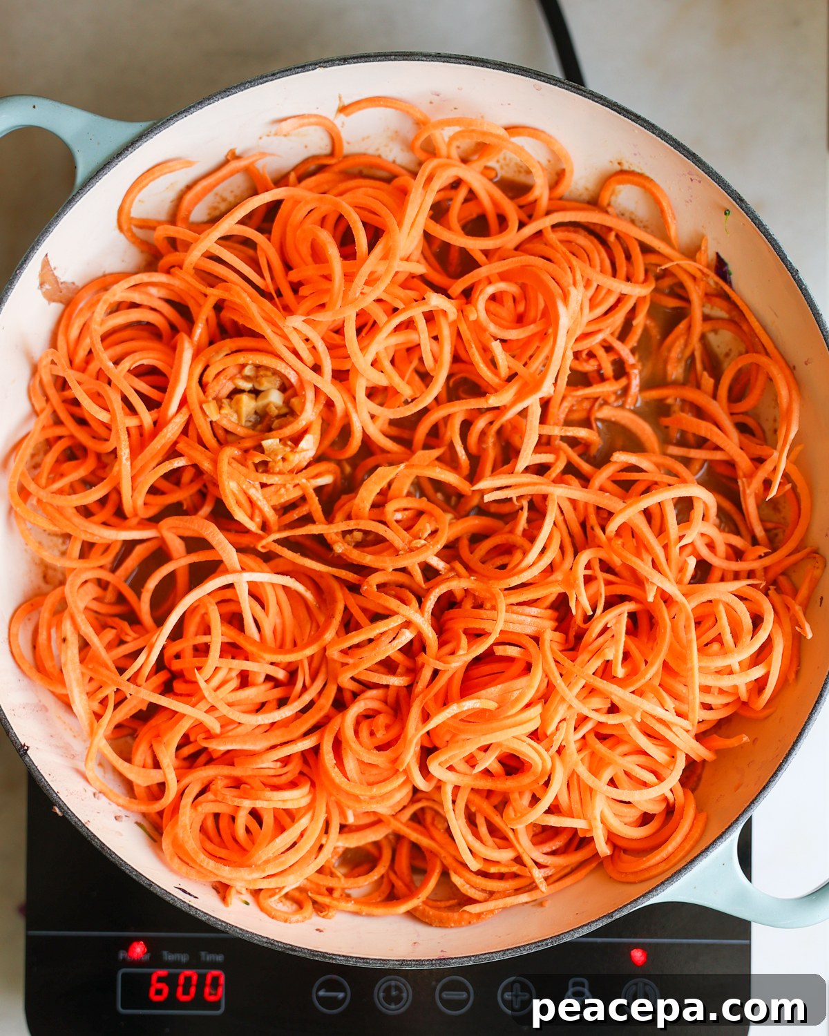 spiralized sweet potato noodles in pan