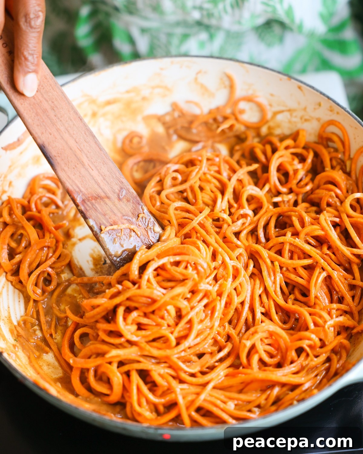 stirring sweet potato noodles