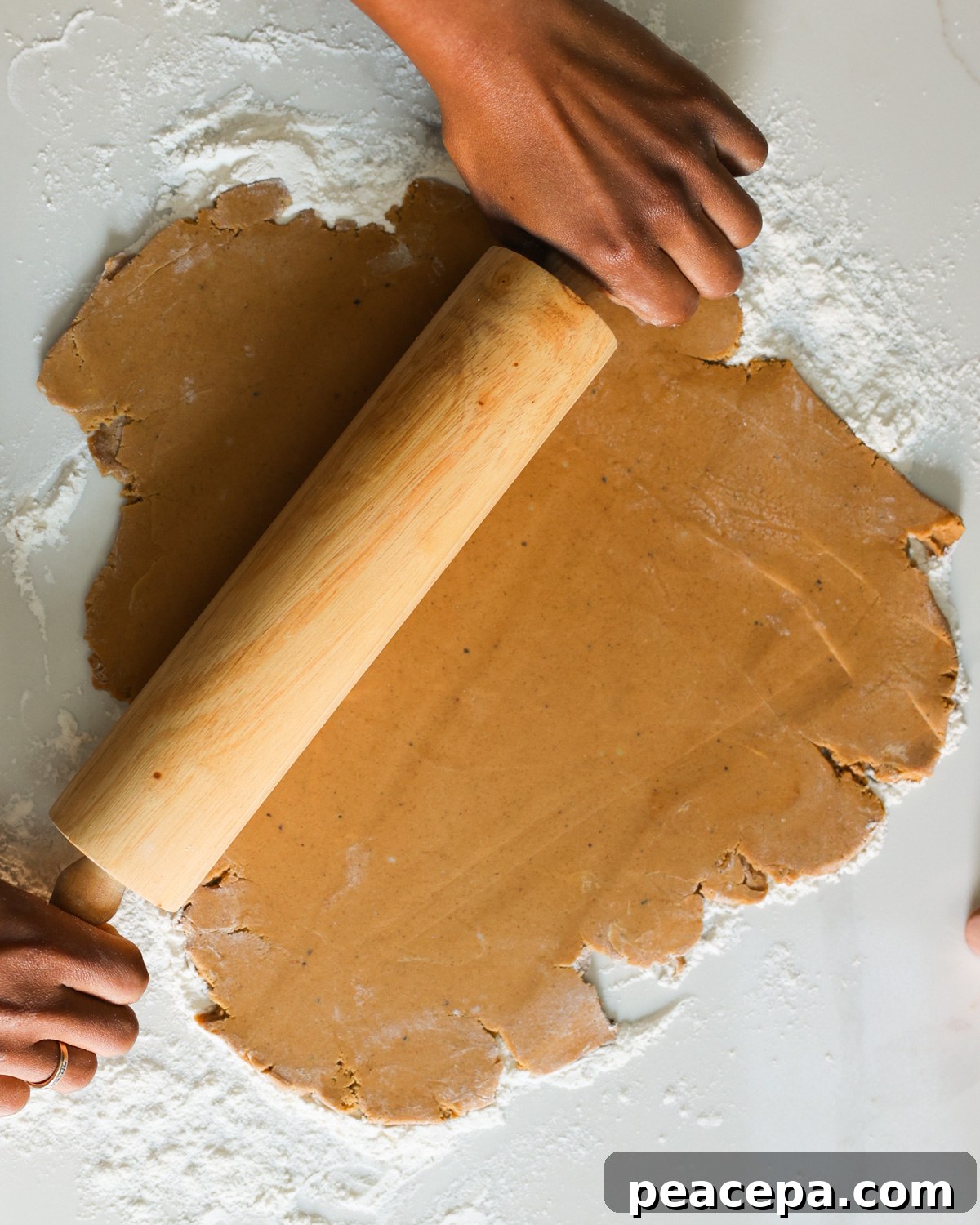 rolling out gingerbread cookie dough
