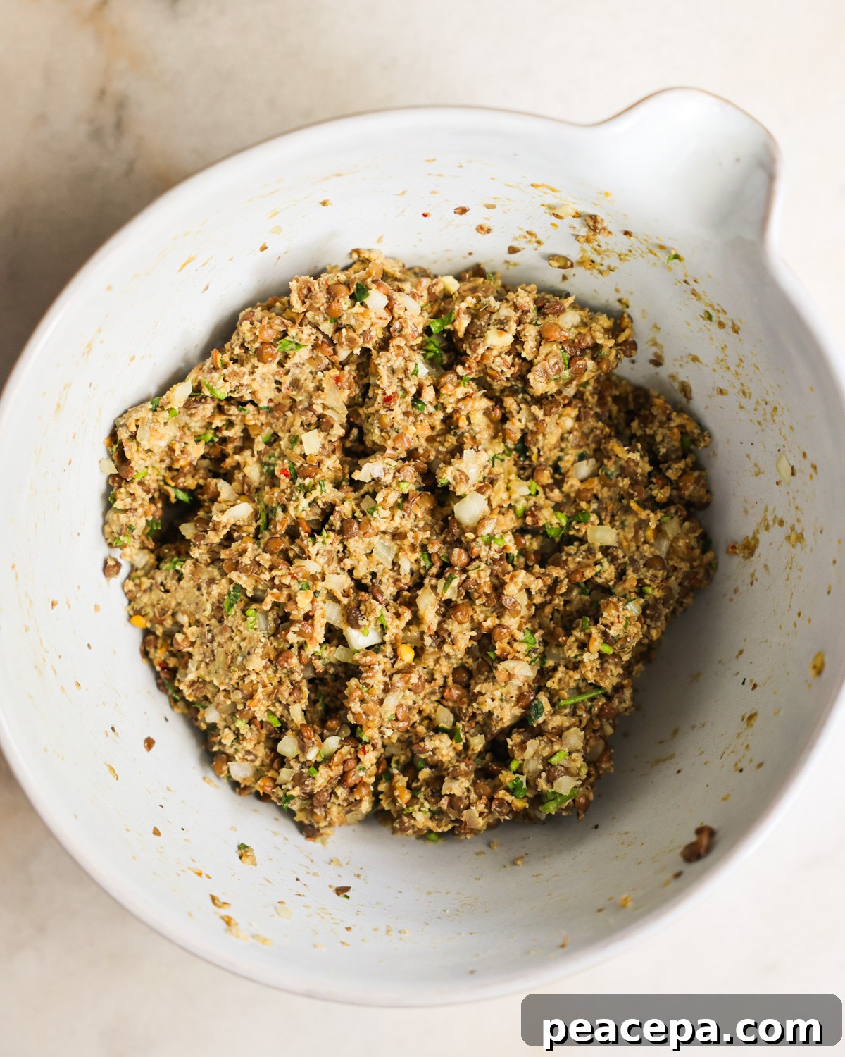 Lentil meatballs batter in a bowl.