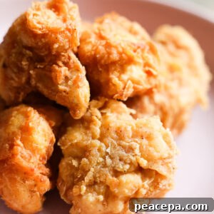 Closeup of vegan fried chicken on pastel purple plate