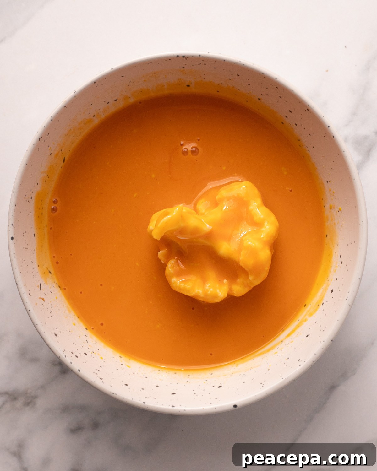 overhead of cauliflower dipped in wet batter