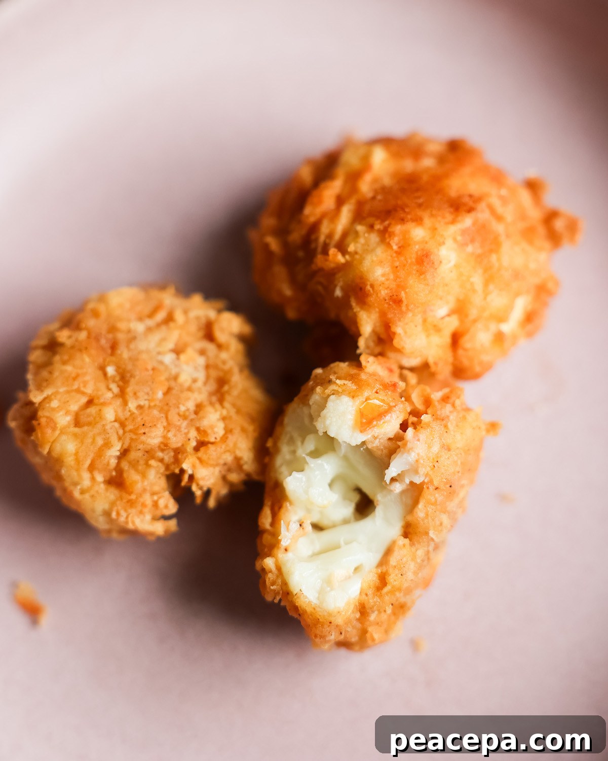 cauliflower vegan fried chicken with bite taken