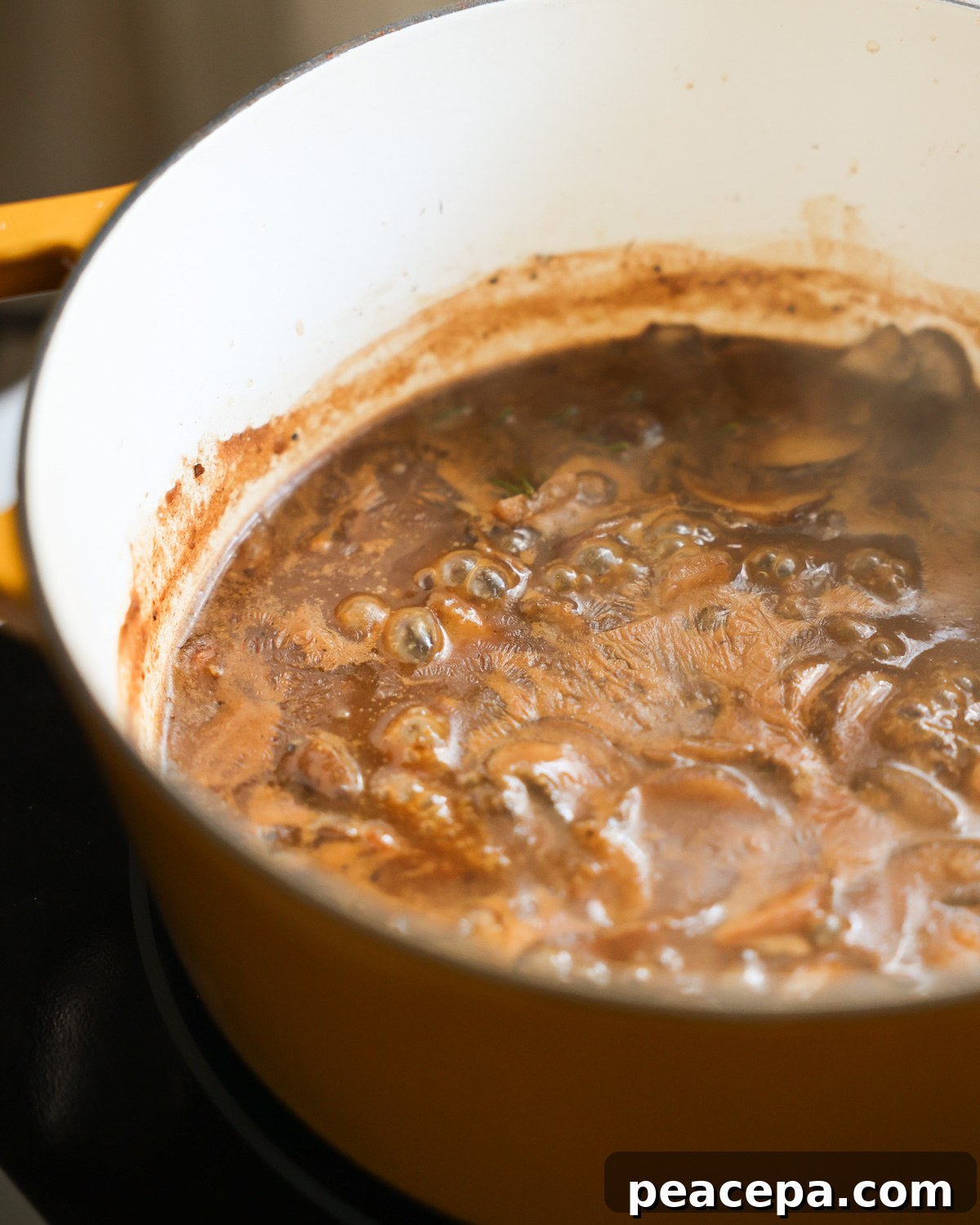vegan mushroom gravy simmering in pot