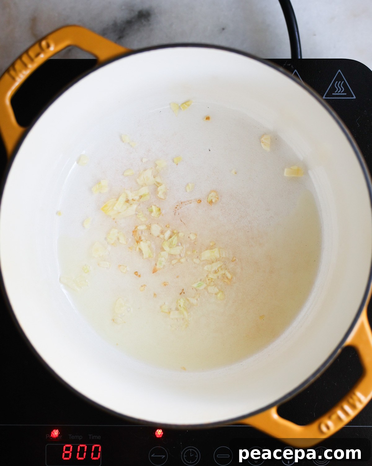 garlic sautéing in pot