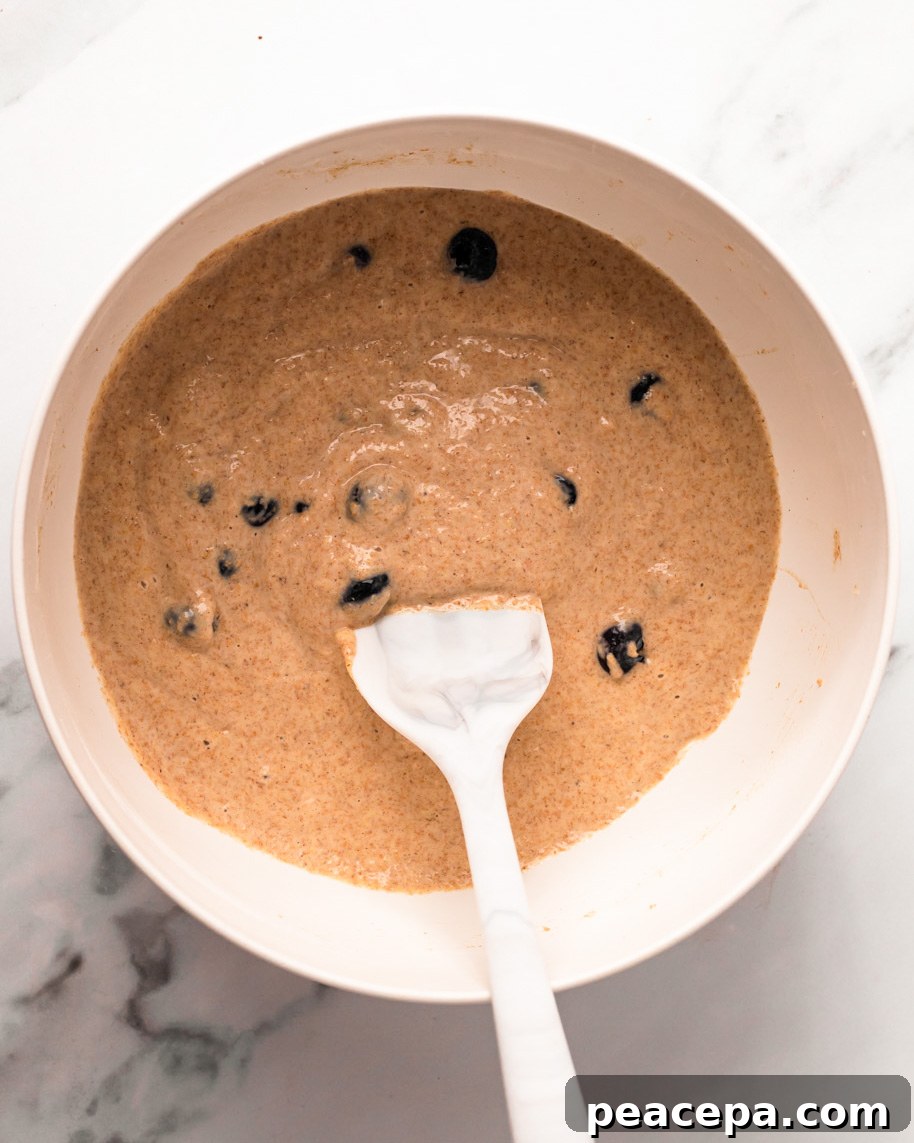 A mixing bowl of the vegan blueberry pancake batter.