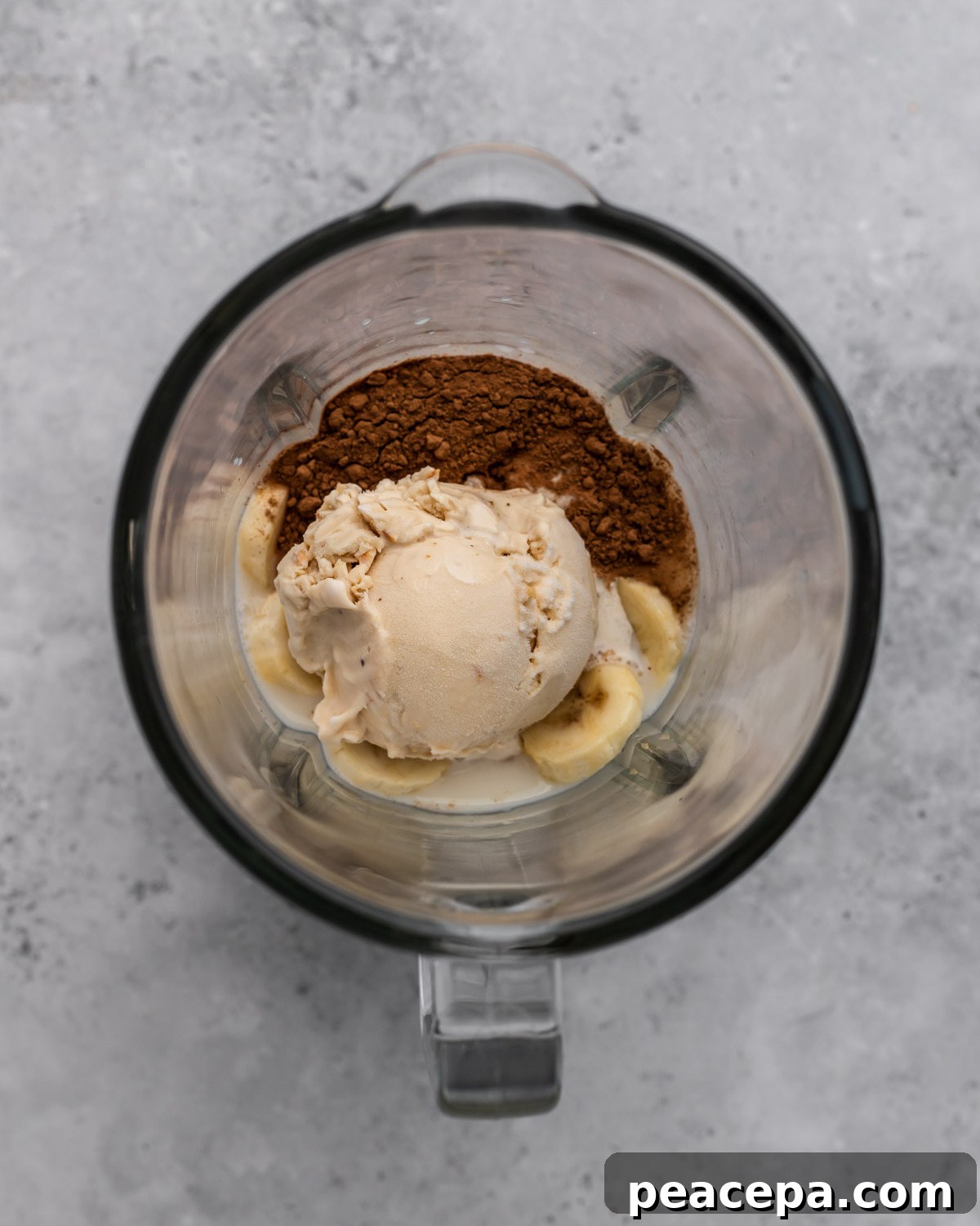 overhead of vegan milkshake ingredients in a blender