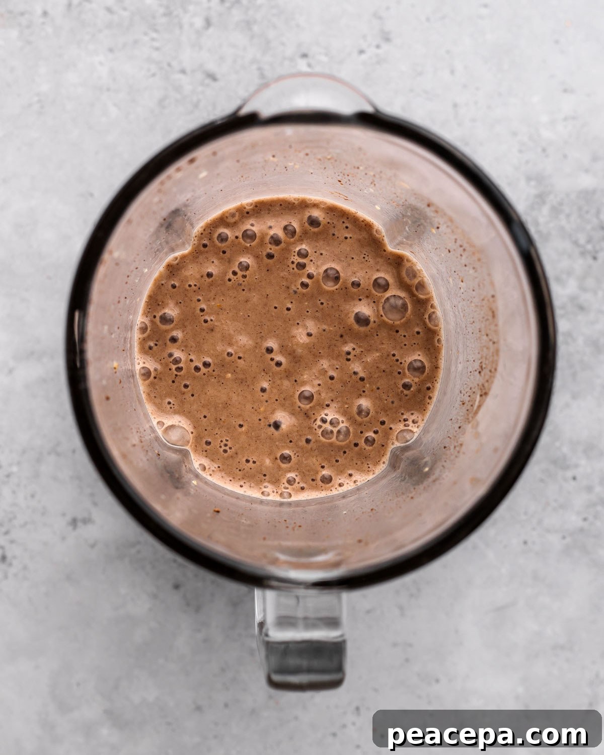 overhead of creamy blended vegan milkshake