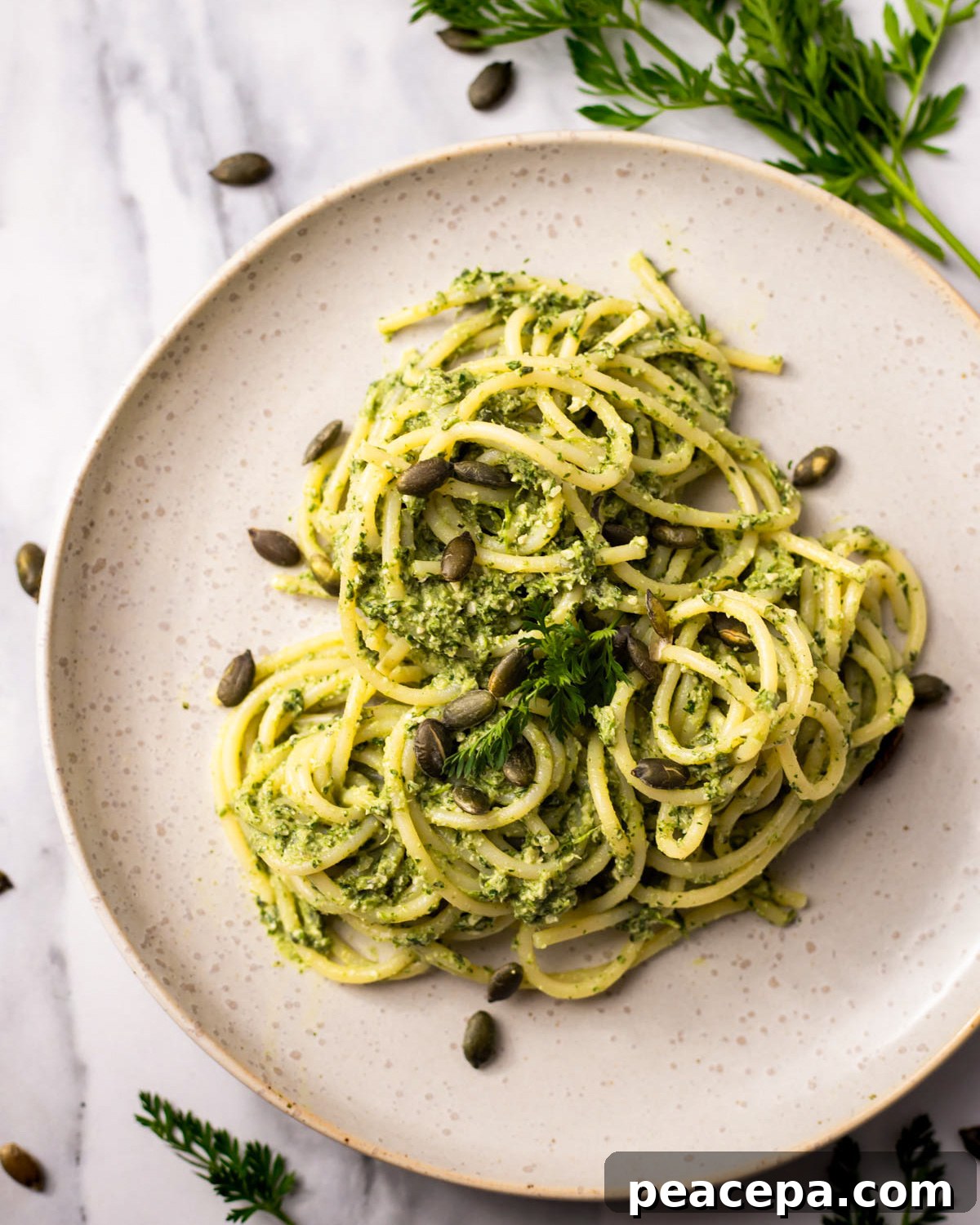 pasta tossed in carrot top pesto