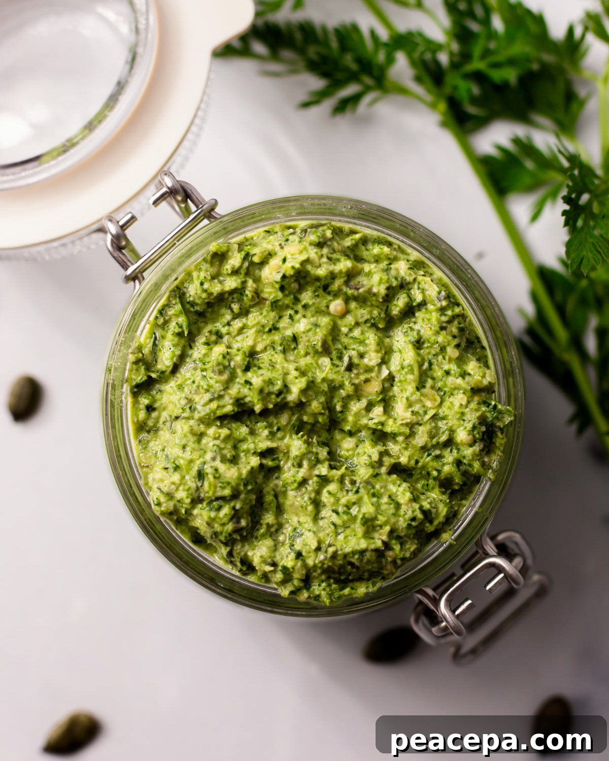 carrot top pesto in a glass jar
