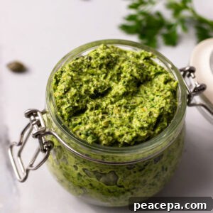 carrot top pesto in a glass jar