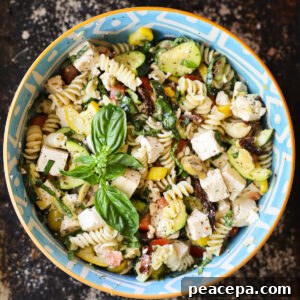 mediterranean pasta salad in a blue bowl